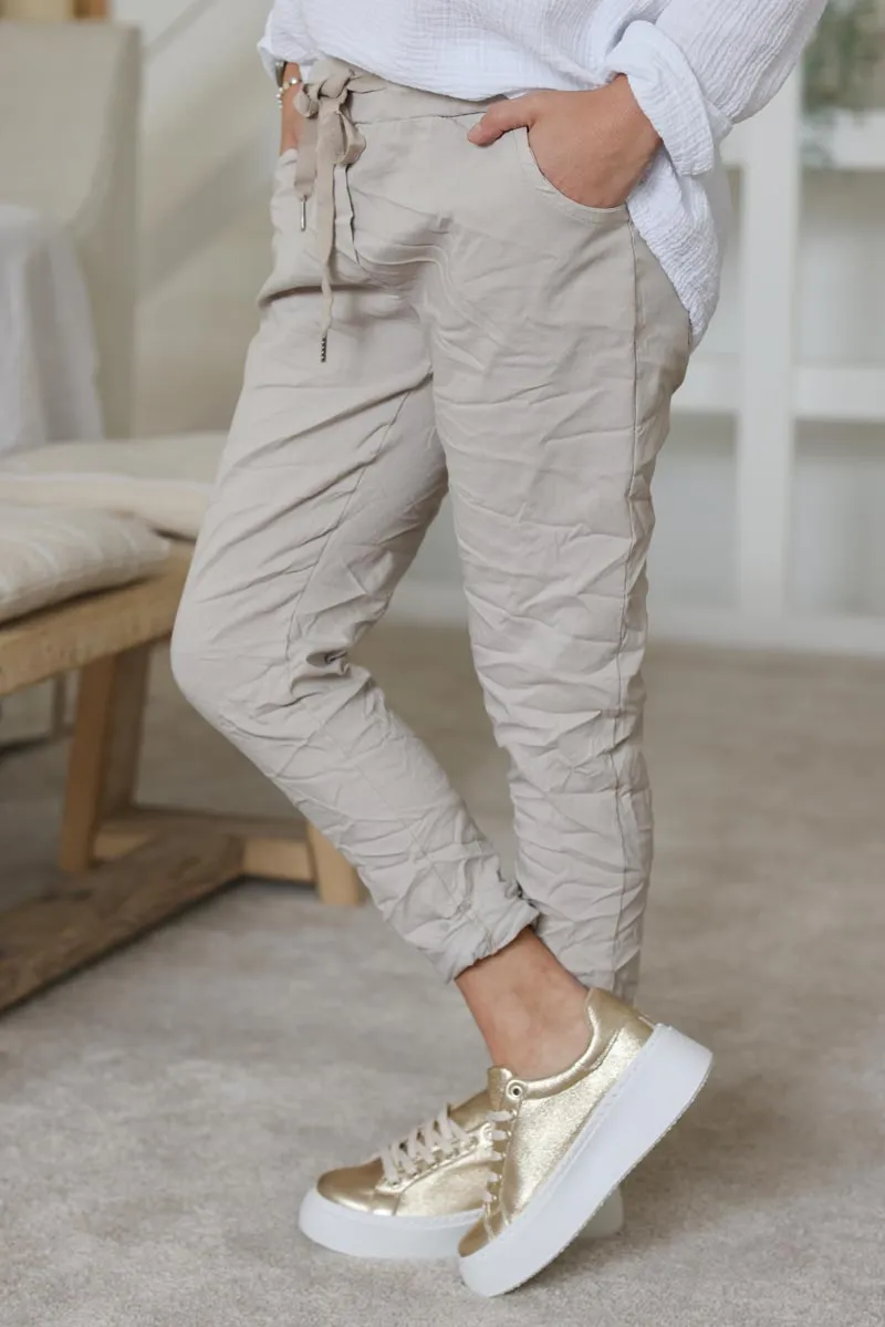 Pantalon confort beige en toile stretch étoile brillante paillettes