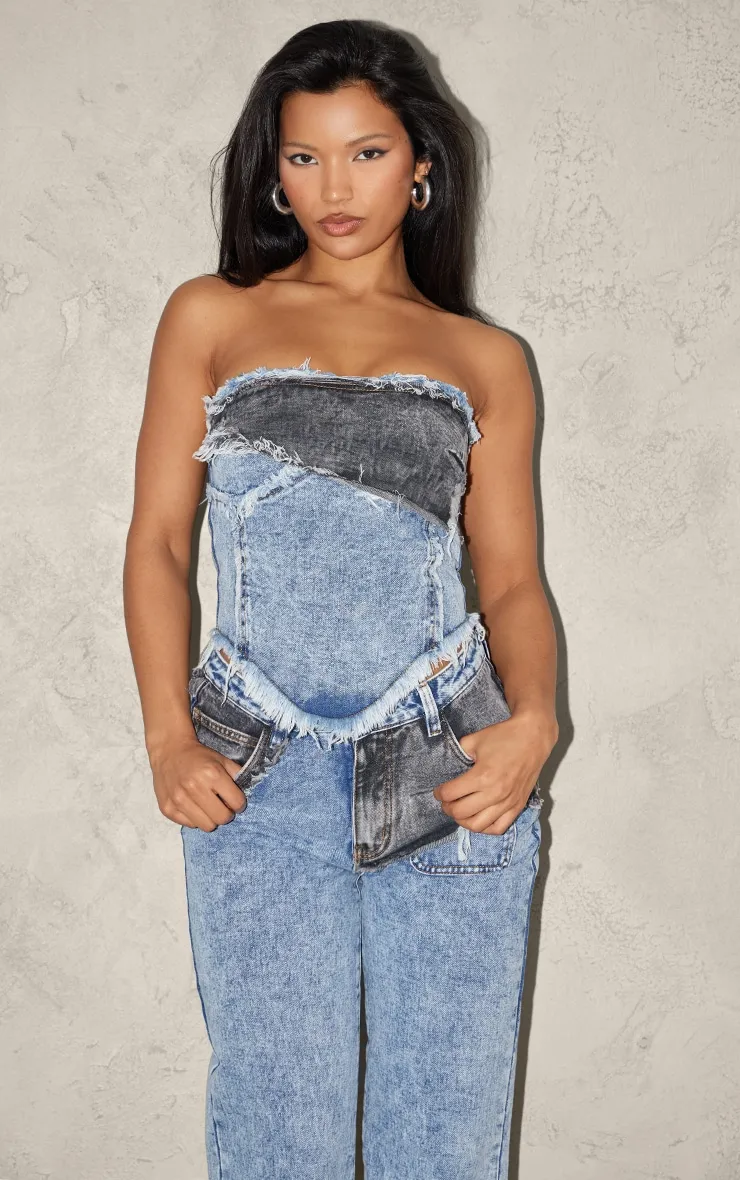 Top bustier en jean bleu javélisé à parties superposées et ourlet élimé